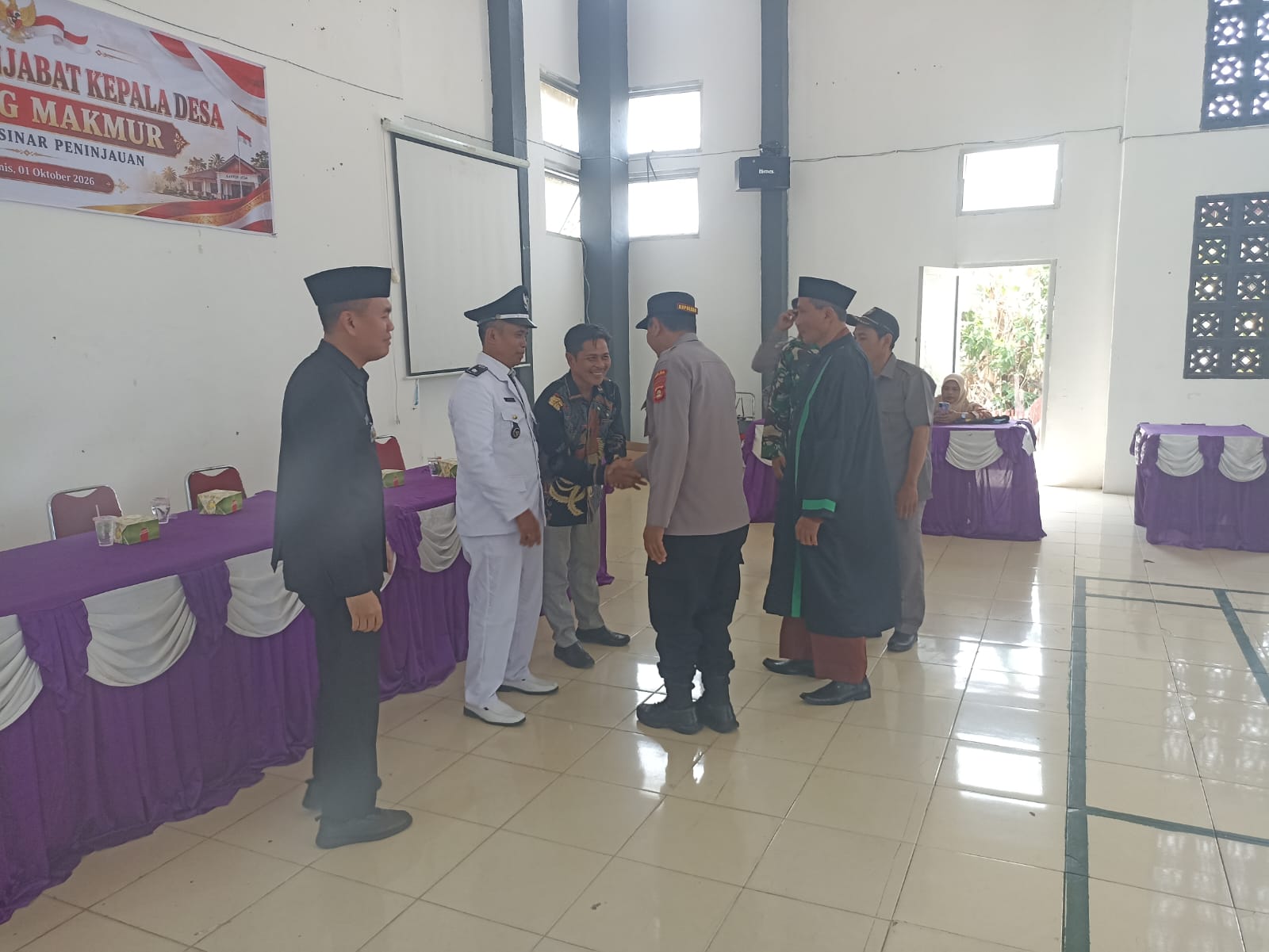 Kapolsek Sinar Peninjauan Hadiri Pelantikan Penjabat Kepala Desa Tanjung Makmur